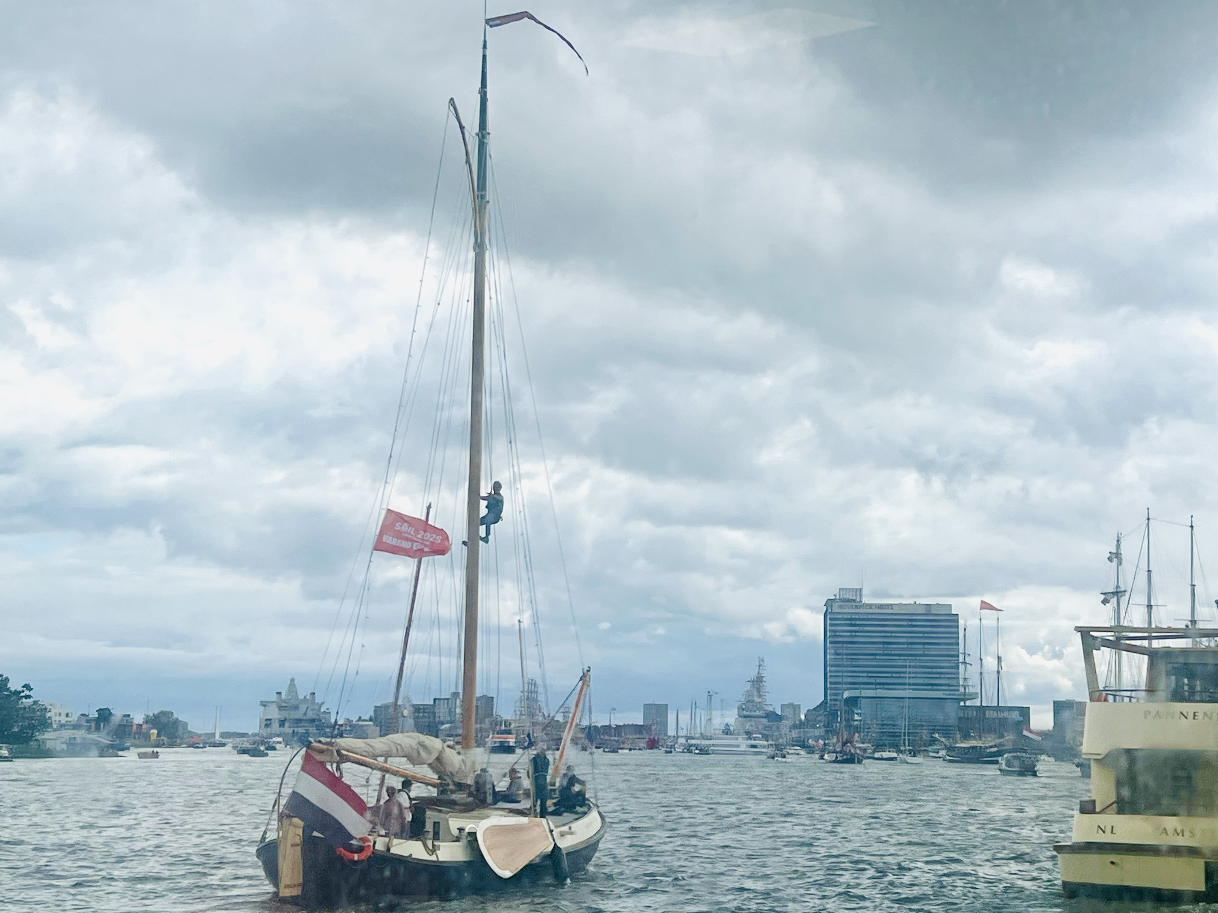 A man hanging from a ship